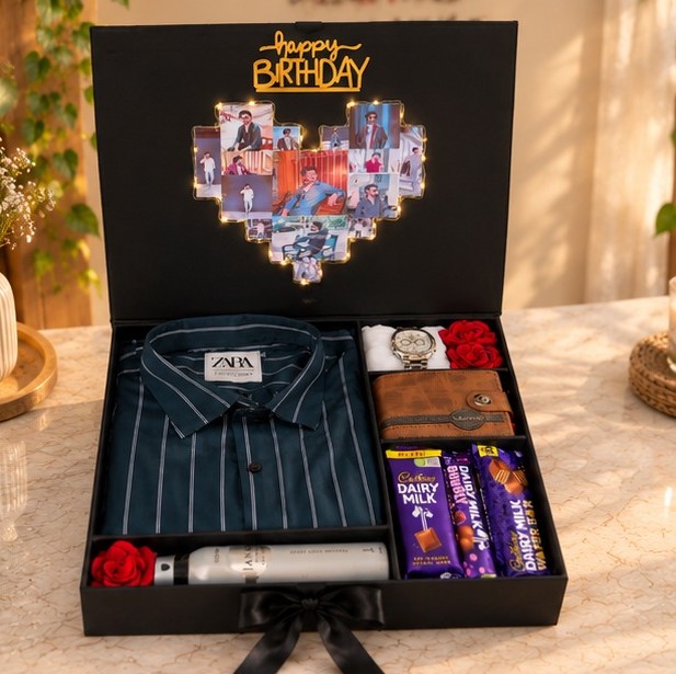 Open black birthday gift box featuring a personalized illuminated photo collage, striped shirt, wristwatch, wallet, fragrance, roses and assorted chocolates.